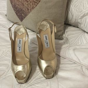 Jimmy Choo gold heel.